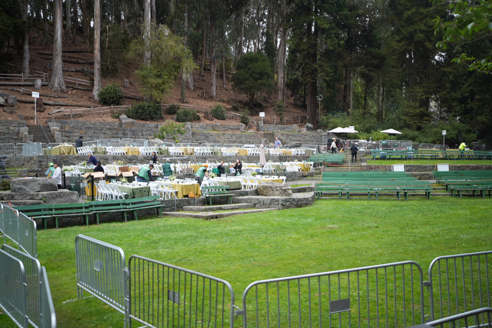 Tables and benches being set up in the Stern Grove amphitheater before the show